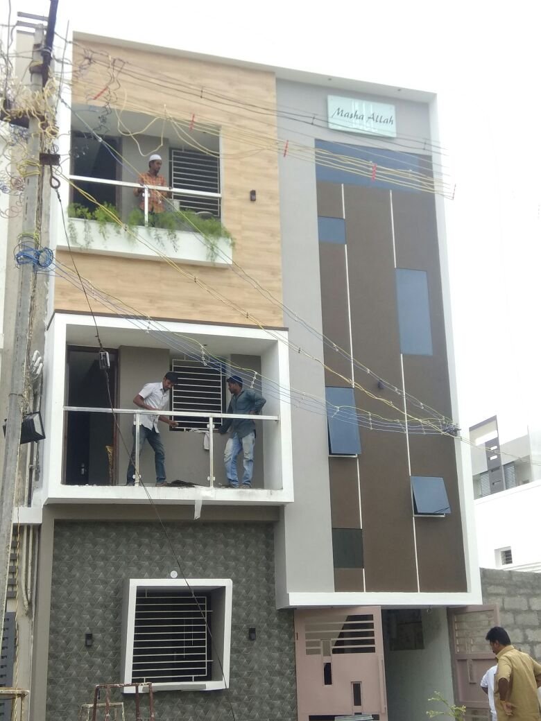 Residential project under construction with workers on site
