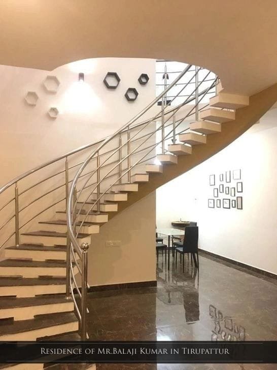 High ceiling double height residential interior with spiral staircase in Tirupattur